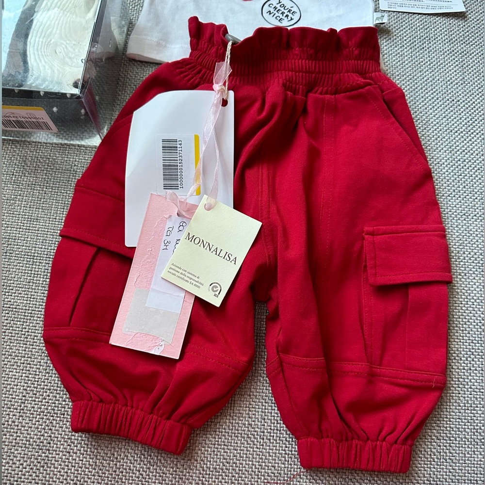 NWT never worn red MonnLisa baby pants with pockets. Size 3 months.